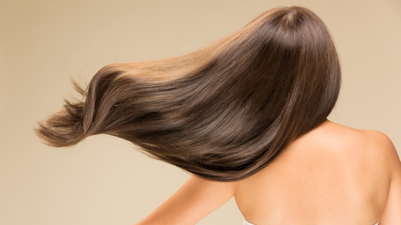 Woman with straight, bouncy hair