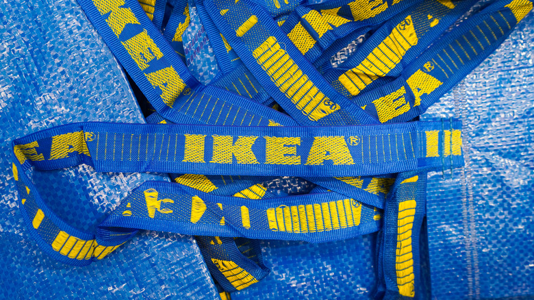 Close up of yellow and blue Ikea tote bags