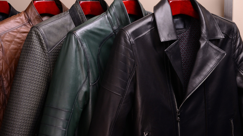 Leather jackets hanging in closet