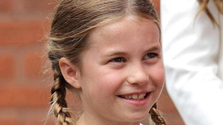 Princess Charlotte smiling in pigtails