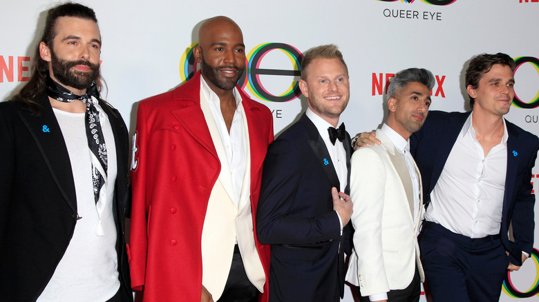 Queer Eye cohosts wearing suits