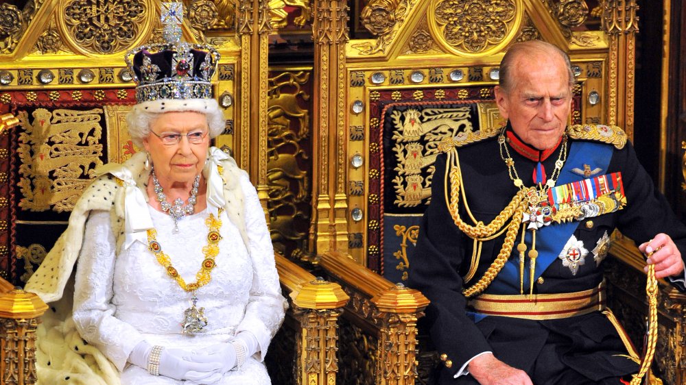 queen Elizabeth and prince Philip in state regalia