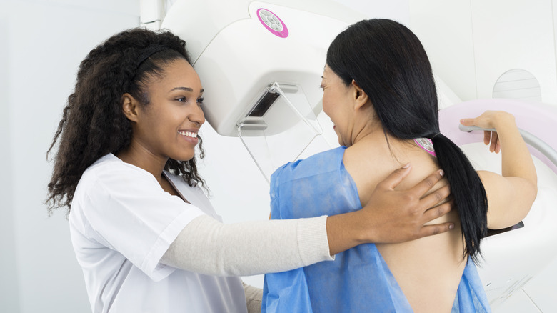 Nurse helping a patient during mammogram