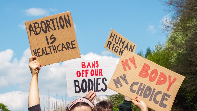 people holding pro-choice protest signs