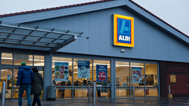 Customers entering an Aldi store