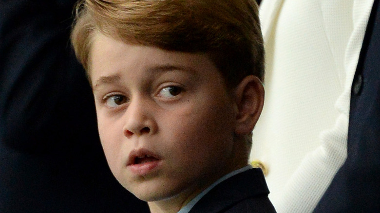 Prince George poses for the camera