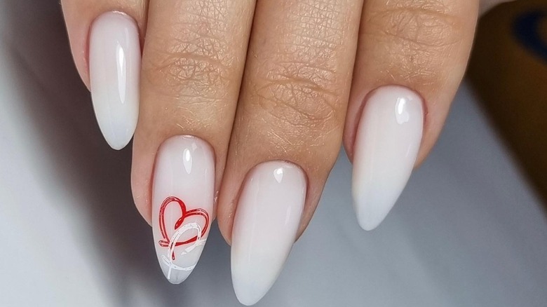 Cream sculpted nails with red and white heart