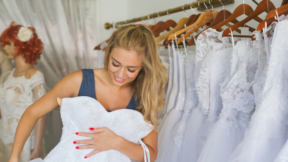 Woman picking wedding dress