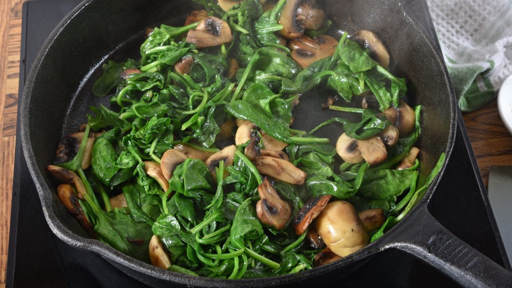 mushrooms and spinach in a skillet