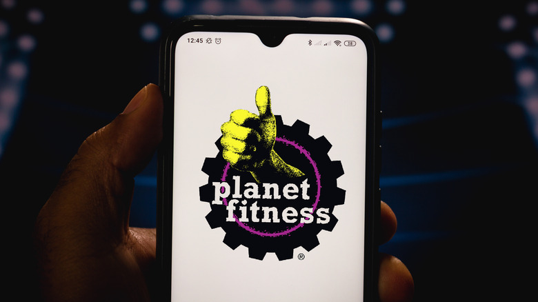 A photo of the Planet Fitness App on a phone