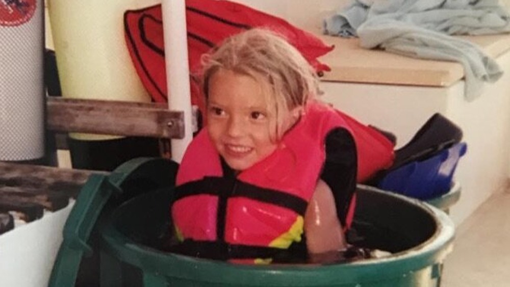 Anya Taylor-Joy as a girl in a bucket