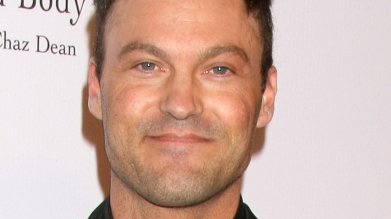 Brian Austin Green smiling for the camera at an event