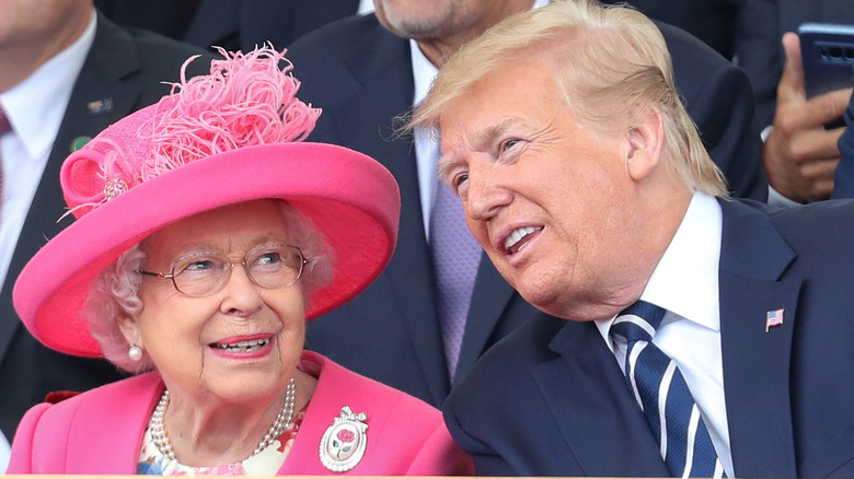 Queen Elizabeth smiling with Donald Trump