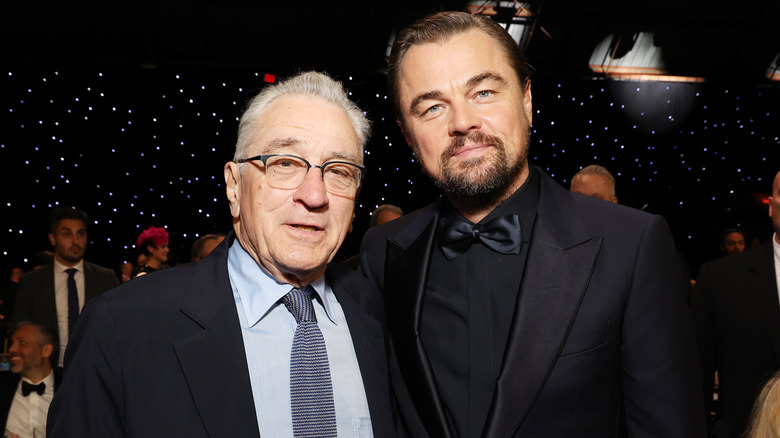 Robert De Niro and Leonardo DiCaprio smiling