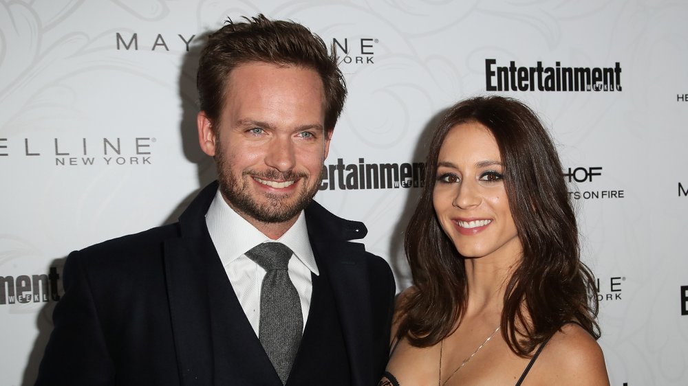 Patrick J. Adams and Troian Bellisario at a red carpet event