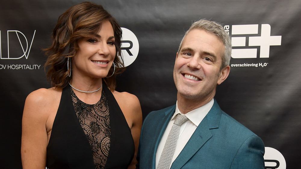LuAnn de Lesseps and Andy Cohen pose on red carpet