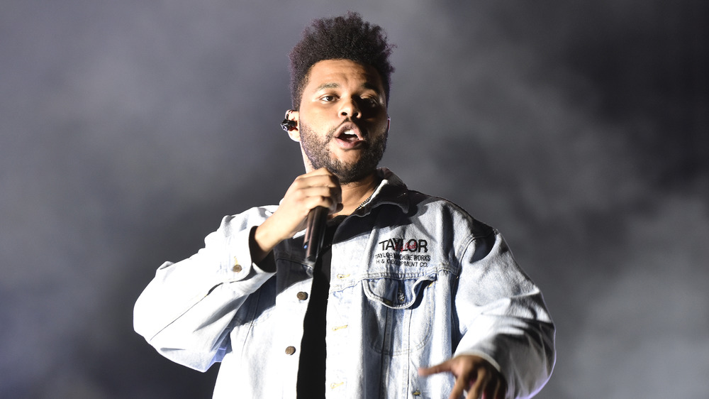 The Weeknd performing in denim jacket