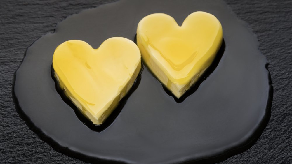 High cholesterol butter melting in a heart