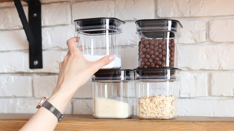 clear storage containers on kitchen shelf