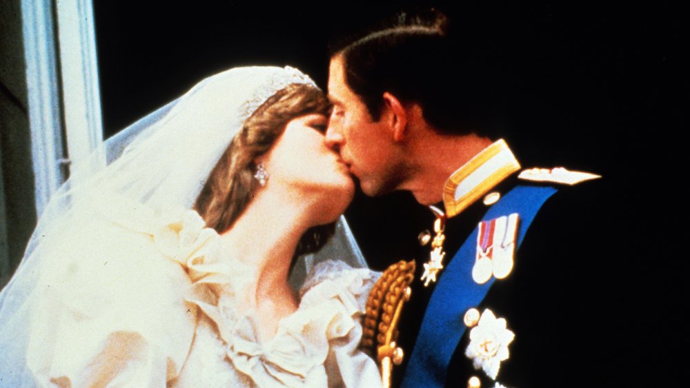 Princess Diana and Prince Charles kissing on their wedding day