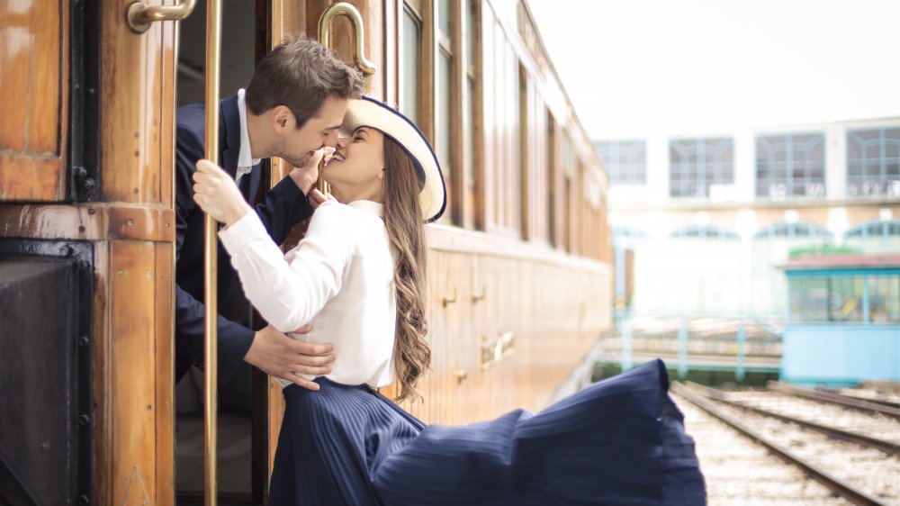 Couple saying goodbye on train