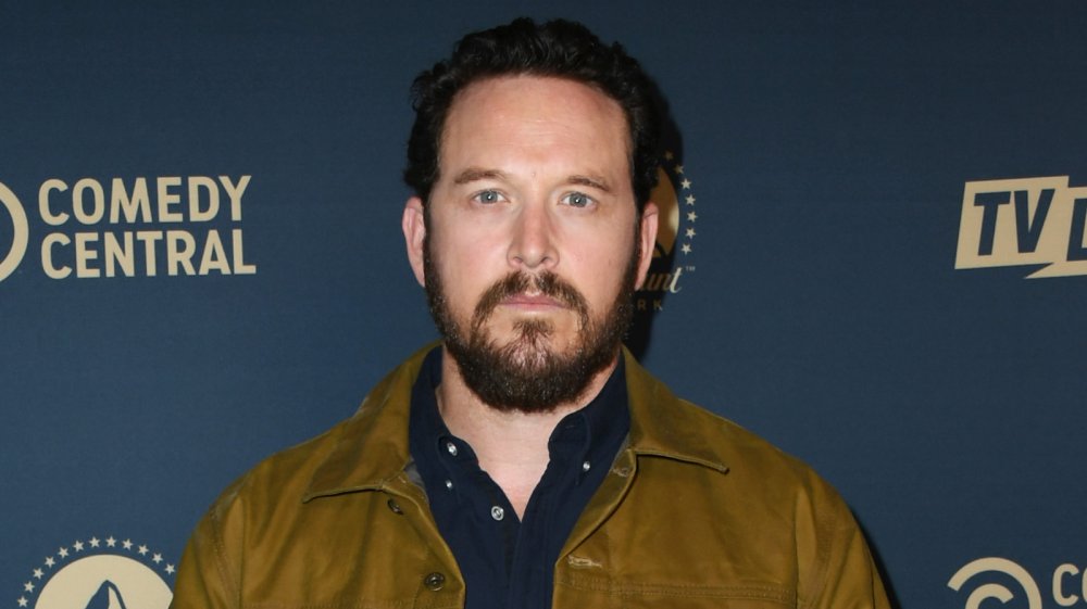Cole Hauser posing with a neutral expression at a Comedy Central event