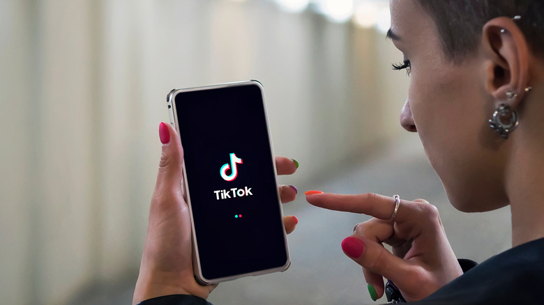 Woman opening TikTok app