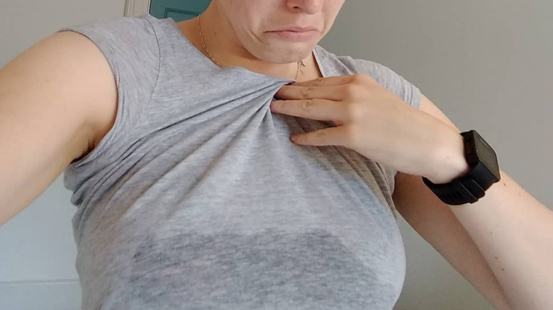 Woman showing underboob sweat