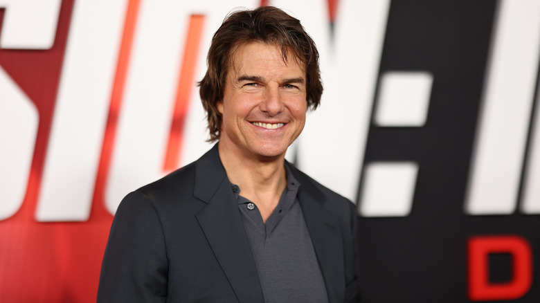 Tom Cruise smiling at a Mission: Impossible premiere