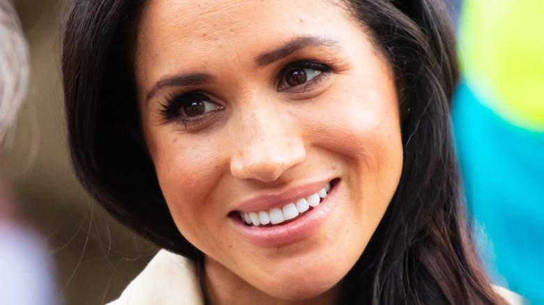 Meghan Markle smiling on outing