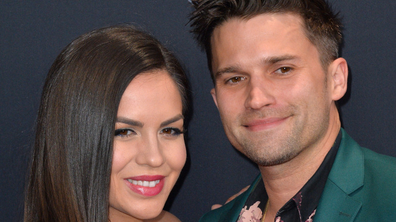 Katie Maloney and Tom Schwartz pose at an event