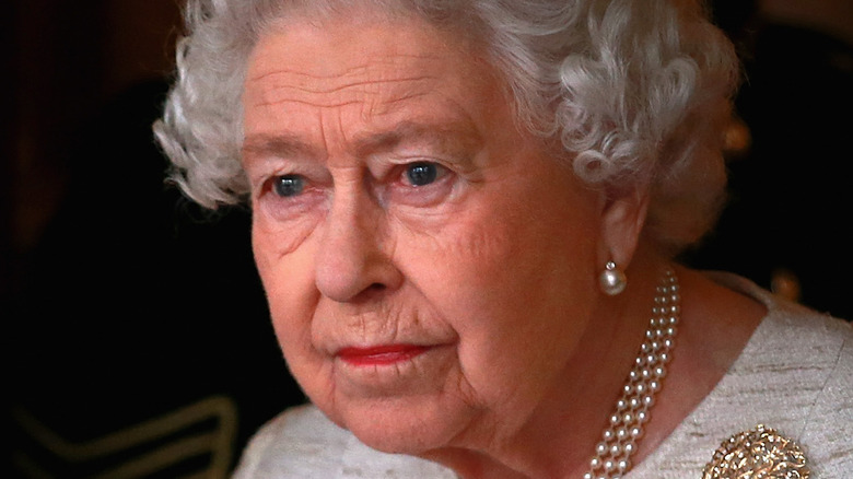 The queen looking somber