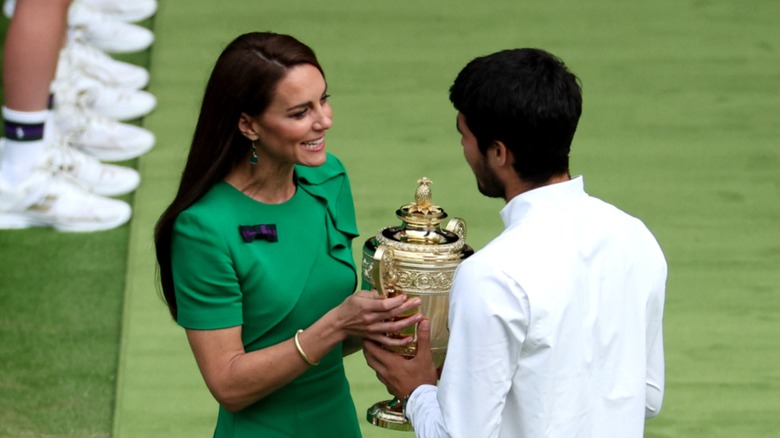 Kate Middleton handing Carlos Alcaraz Wimbledon 2023 trophy