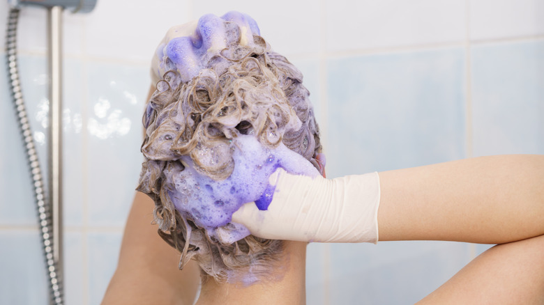 woman using purple shampoo