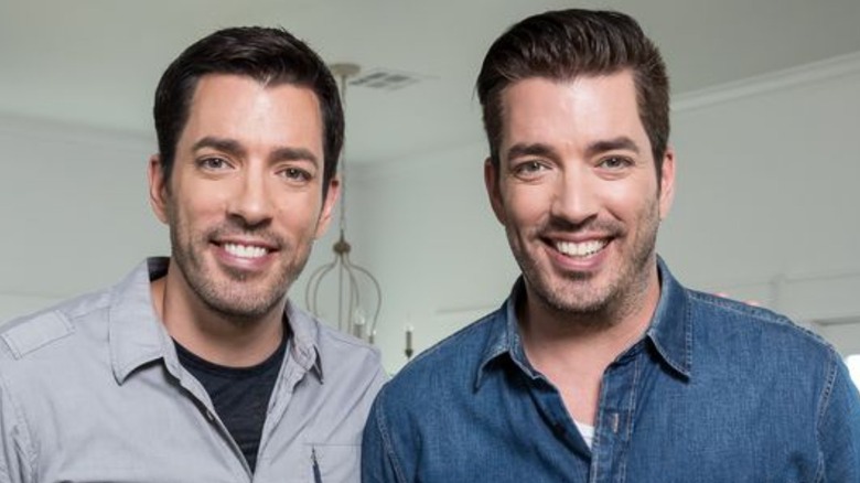 Drew and Jonathan Scott pose in a promo shot for Property Brothers