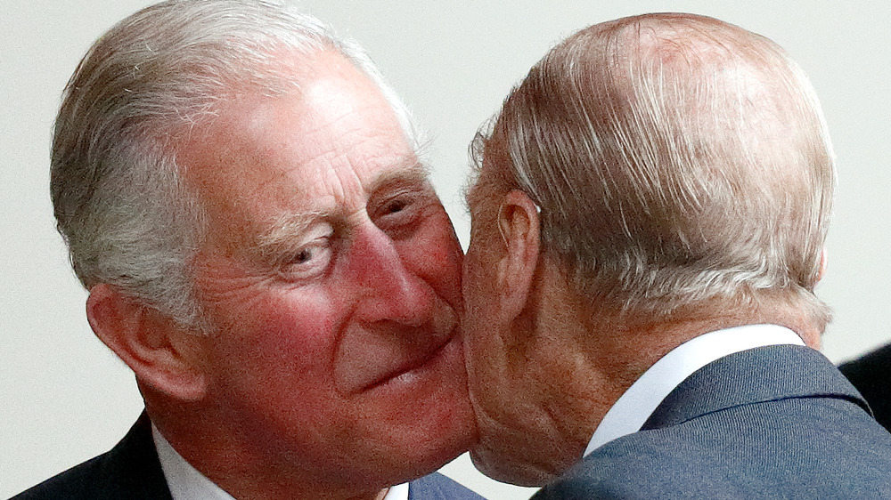 Prince Charles saying hello to Prince Philip
