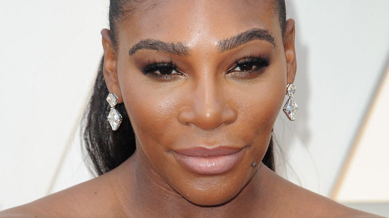 Serena Williams looking up, smiling