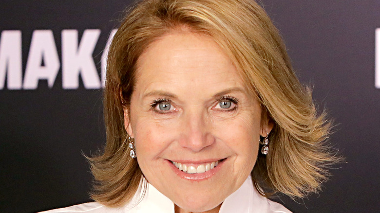 Katie Couric smiles onstage