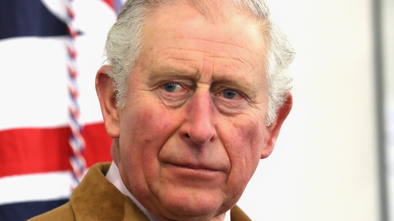 King Charles III looks somber 2022