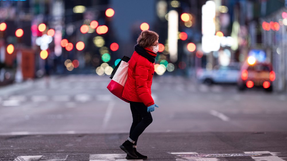 Woman walking across the street in New York