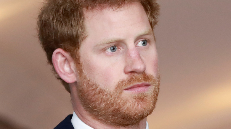 Prince Harry staring sternly to the side
