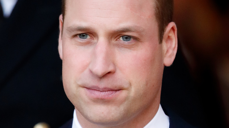 Prince William pointing at his own face
