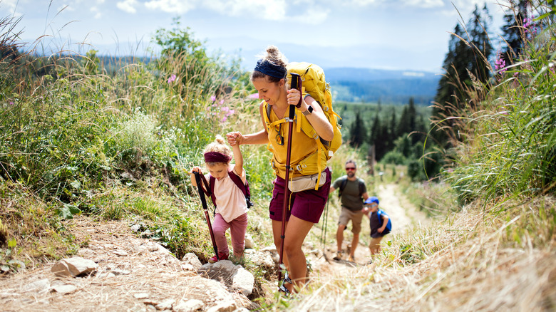 Woman hiking with her children