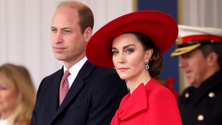 Prince William and Kate Middleton frowning 