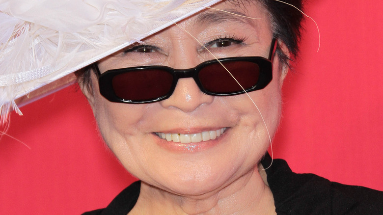 Yoko Ono in feathered hat