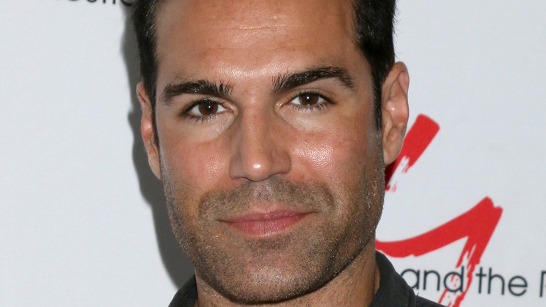 Jordi Vilasuso the actor who plays Rey on The Young and the Restless smiling softly